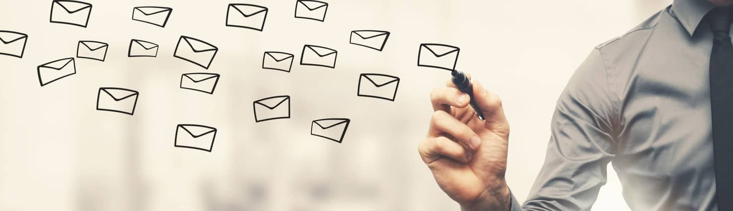 sending email concept - businessman drawing envelopes in offiice with marker pen