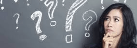 A woman surrounded by question marks